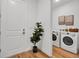 Convenient laundry area with modern appliances, neutral wall art and stylish decor at 600 3Rd S Ave # 201, St Petersburg, FL 33701