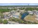 Aerial view of condos surrounding a serene pond with fountain and bridge at 600 Gardens Edge Dr # 614, Venice, FL 34285