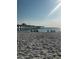 Beautiful beach with people enjoying the day with the pier in the background at 600 Gardens Edge Dr # 614, Venice, FL 34285