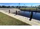Community boat ramp featuring a concrete ramp and dock on a sunny day at 600 Gardens Edge Dr # 614, Venice, FL 34285
