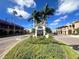 Welcoming entrance to Venice featuring palm trees and signs for local attractions at 600 Gardens Edge Dr # 614, Venice, FL 34285