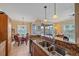 Kitchen overlooks the dining area with access to screened lanai overlooking a beautiful lake at 600 Gardens Edge Dr # 614, Venice, FL 34285