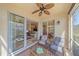 Comfortable screened-in lanai featuring peaceful views of the lake and surrounding community at 600 Gardens Edge Dr # 614, Venice, FL 34285