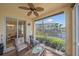 Inviting screened-in lanai offering serene water views and comfortable seating at 600 Gardens Edge Dr # 614, Venice, FL 34285