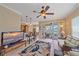 Open-concept living area with bar seating, access to porch, and water views at 600 Gardens Edge Dr # 614, Venice, FL 34285