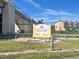 Marina Park signage with a view of a bridge and nearby townhouses and landscaping at 600 Gardens Edge Dr # 614, Venice, FL 34285