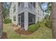Beautiful condo corner featuring a private screened lanai surrounded by lush landscaping and manicured lawn at 600 Gardens Edge Dr # 614, Venice, FL 34285