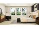 Bright bedroom featuring large windows, elegant furnishings, and a serene, welcoming ambiance at 6838 E 115Th St, Palmetto, FL 34221