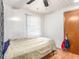 Bedroom featuring dark wood flooring at 705 E Alabama St, Plant City, FL 33563