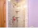 Shower featuring a shower head, two shelves, and a glass door at 705 E Alabama St, Plant City, FL 33563