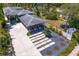 Aerial view showcasing a well-maintained home with modern landscaping, multiple garages, and a private yard at 7508 N Ola Ave, Tampa, FL 33604