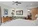 Spacious bedroom featuring wood floors, large windows, and a cozy seating area with a sofa at 7508 N Ola Ave, Tampa, FL 33604