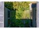 Aerial view of a green courtyard surrounded by the home's architectural structure at 7508 N Ola Ave, Tampa, FL 33604