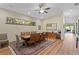 Dining room with hardwood floors, a stained glass window, and a large wooden table at 7508 N Ola Ave, Tampa, FL 33604