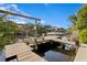 This private dock with a boat lift offers direct access to the water for boating, fishing, and enjoying waterfront living at 7508 N Ola Ave, Tampa, FL 33604