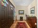Foyer with hardwood floors, a colorful stained glass window, and decorative furnishings at 7508 N Ola Ave, Tampa, FL 33604