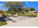 Manicured front yard with modern pavers and black gravel at 7508 N Ola Ave, Tampa, FL 33604