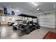 Well-organized garage with ample storage, parking for multiple vehicles and golf cart at 7508 N Ola Ave, Tampa, FL 33604