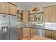 Modern kitchen featuring stainless steel appliances, wooden cabinets, and sleek countertops at 7508 N Ola Ave, Tampa, FL 33604