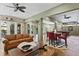 Open-concept living area with seamless transition to outdoor spaces and ample seating at 7508 N Ola Ave, Tampa, FL 33604