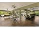 Expansive outdoor lounge area with seating, dining, and bar, perfect for entertaining at 7508 N Ola Ave, Tampa, FL 33604