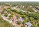 Aerial view of the neighborhood with lush greenery and private pools at 7660 Holiday Dr, Spring Hill, FL 34606