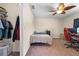 This bedroom features a ceiling fan, closet, and a desk set with an ergonomic gaming chair at 7660 Holiday Dr, Spring Hill, FL 34606