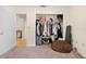 Walk-in closet showing ample hanging space with shelf for storage of clothes and personal items at 7660 Holiday Dr, Spring Hill, FL 34606