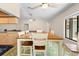 A bright dining room features a large window and classic wooden furniture, perfect for Gathering meals at 7660 Holiday Dr, Spring Hill, FL 34606