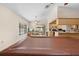 An open-concept living space includes a kitchen and dining area with seamless transition and views throughout the room at 7660 Holiday Dr, Spring Hill, FL 34606