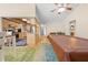 An open-concept living space includes a kitchen and dining area with seamless transition and views throughout the room at 7660 Holiday Dr, Spring Hill, FL 34606