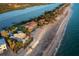 Beautiful aerial view showcases the beachfront homes with direct access to the ocean at 770 N Manasota Key Rd, Englewood, FL 34223