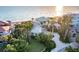 Stunning beachfront home boasts lush landscaping, a circular driveway, and breathtaking ocean views at 770 N Manasota Key Rd, Englewood, FL 34223