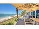 Lovely outdoor space with deck, seating, and picturesque ocean views at 770 N Manasota Key Rd, Englewood, FL 34223