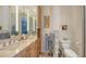 Bathroom offers dual vanities, bright lighting, and elegant fixtures, creating a serene retreat at 770 N Manasota Key Rd, Englewood, FL 34223