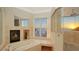 This luxury bathroom boasts both a soaking tub and a stand up shower with ocean views at 770 N Manasota Key Rd, Englewood, FL 34223