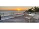 Enjoy stunning Gulf views from this deck with lounge and dining seating at 770 N Manasota Key Rd, Englewood, FL 34223