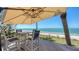 Enjoy breathtaking ocean vistas from this outdoor seating on the sandy beach at 770 N Manasota Key Rd, Englewood, FL 34223