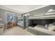 Charming bunk bedroom is brightly lit, featuring two full sized bunk beds, storage, and a view at 770 N Manasota Key Rd, Englewood, FL 34223
