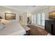 Bedroom boasts a painting over the dresser, with access to a personal workspace and an exit to the exterior at 770 N Manasota Key Rd, Englewood, FL 34223
