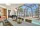 Outdoor dining area offers peaceful pool views and a tranquil entertaining space at 770 N Manasota Key Rd, Englewood, FL 34223