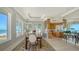 Dining room with waterfront views and access to the kitchen at 770 N Manasota Key Rd, Englewood, FL 34223