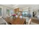 Open-concept dining area with an adjacent kitchen and beautiful waterfront views at 770 N Manasota Key Rd, Englewood, FL 34223