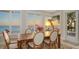 Bright dining area featuring a wooden table and chairs, with stunning ocean views at 770 N Manasota Key Rd, Englewood, FL 34223