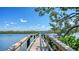 Picturesque private dock with lush foliage and tranquil waterfront views at 770 N Manasota Key Rd, Englewood, FL 34223