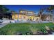 Beautiful waterfront home features lush landscaping, outdoor seating, and beach access at 770 N Manasota Key Rd, Englewood, FL 34223
