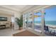 Living area with an outside deck and access to the waterfront at 770 N Manasota Key Rd, Englewood, FL 34223