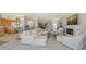 Spacious living room showcasing elegant furnishings, fireplace, and stunning views at 770 N Manasota Key Rd, Englewood, FL 34223