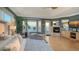 Bedroom featuring large windows with amazing ocean views, a fireplace, and a comfortable seating area at 770 N Manasota Key Rd, Englewood, FL 34223