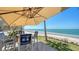 Inviting outdoor dining area with ocean views and comfortable seating at 770 N Manasota Key Rd, Englewood, FL 34223
